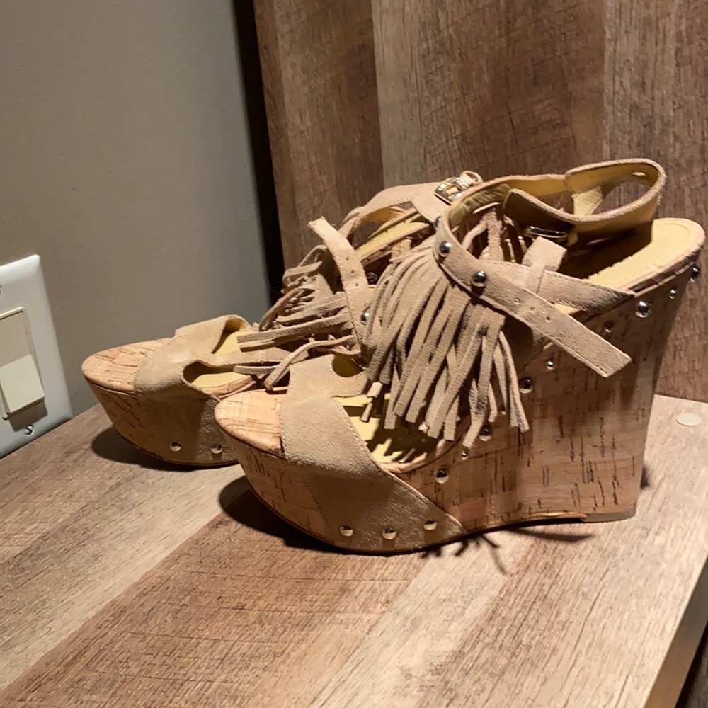 Tan fringe wedges with fringe. Never wore them